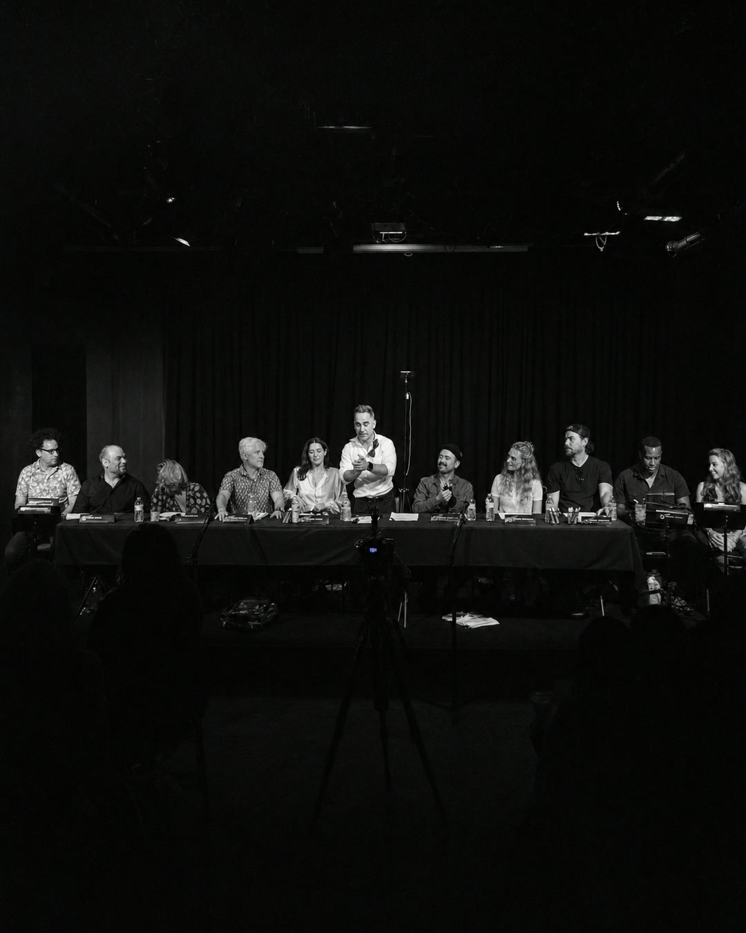 The full cast performing together at the table read