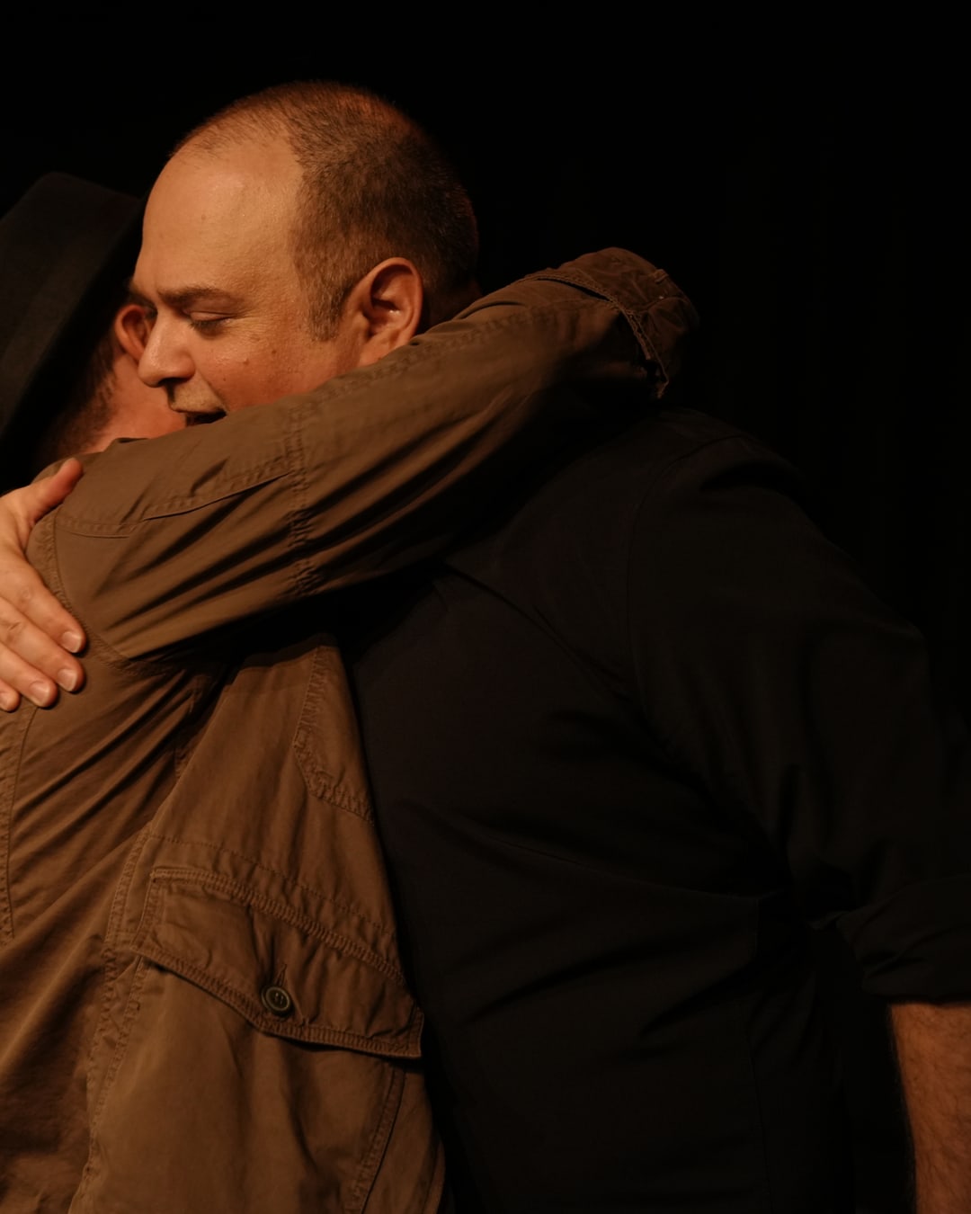 Guests embracing warmly after the table read