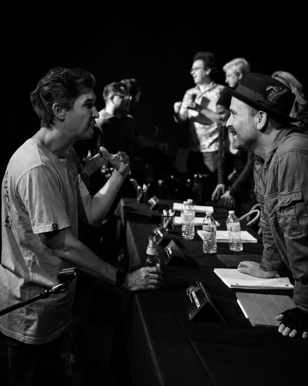 Two cast members talking after the table read