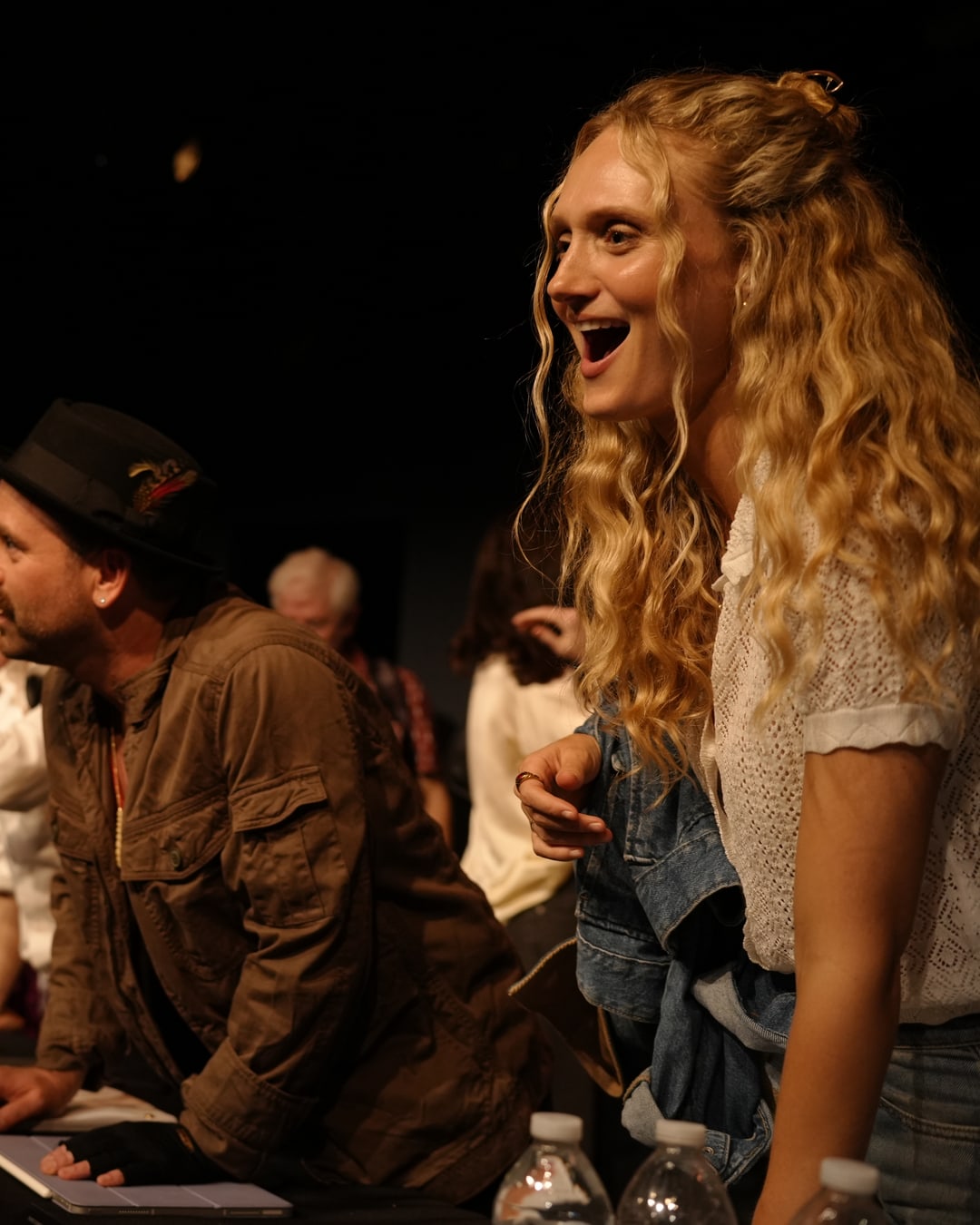 Cast members reacting joyfully after the table read
