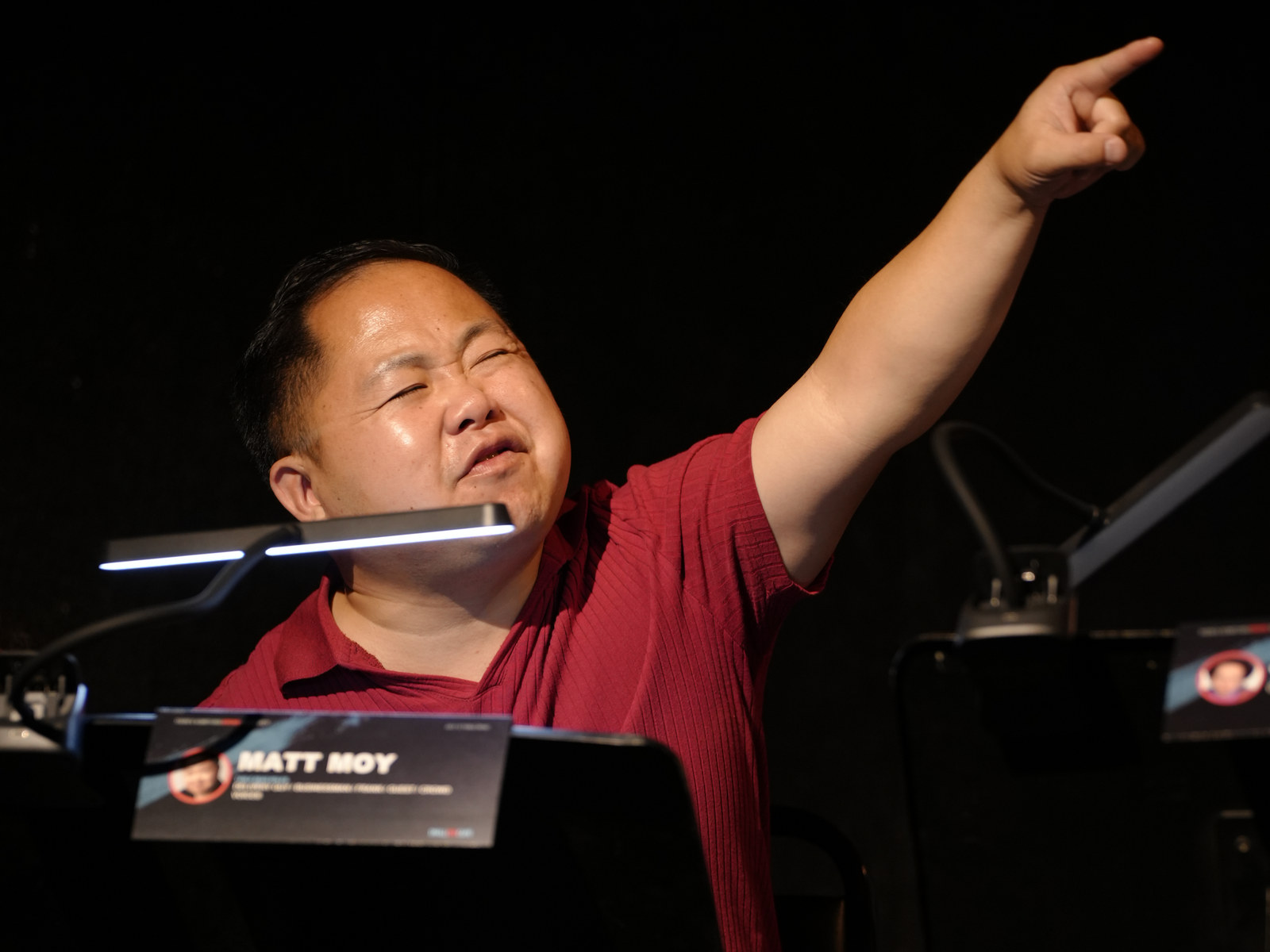A cast member pointing playfully during the table read