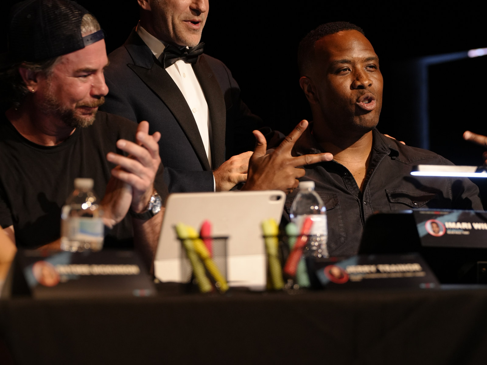Ensemble members gesturing during the table read
